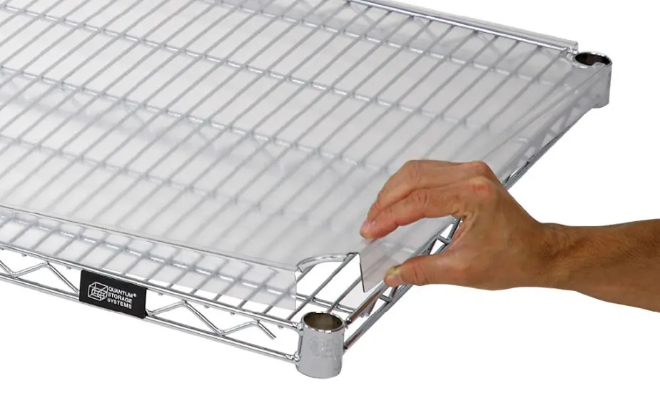 Hand assembling a metal wire shelving unit by attaching a leg.