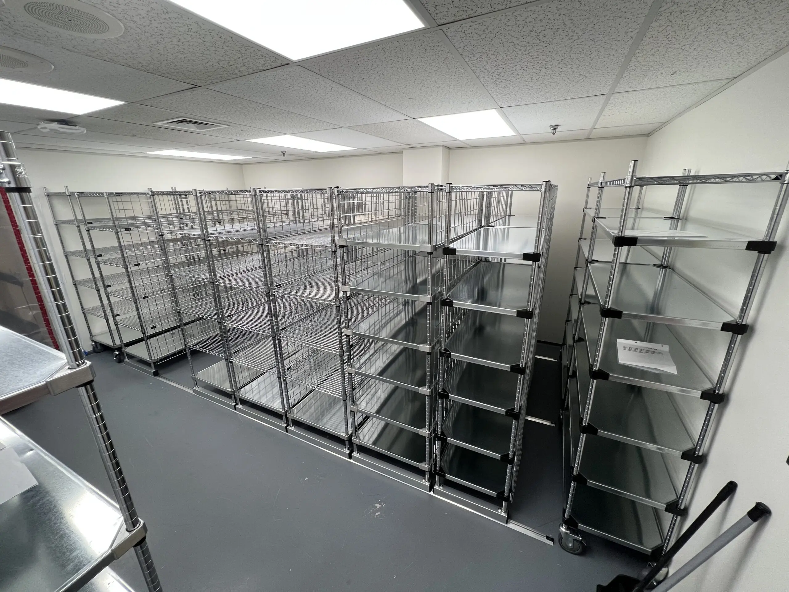 Empty metal shelving racks in storage room