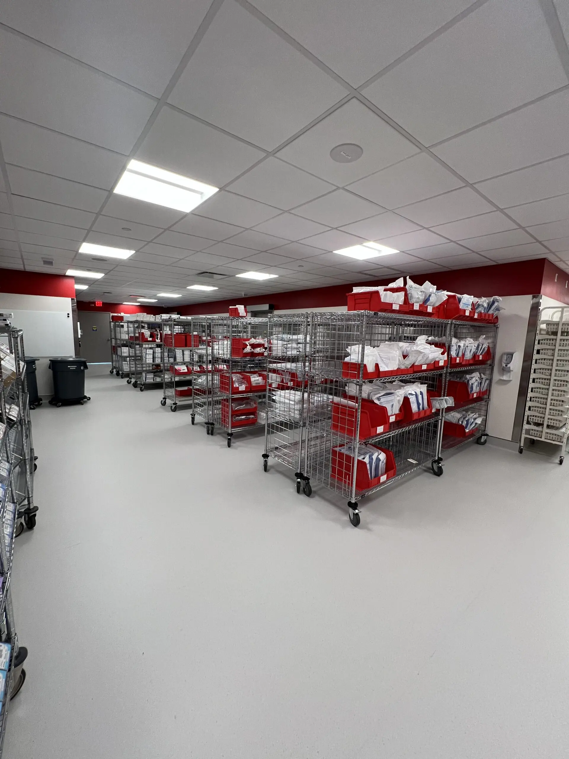 Medical supply room with red bins