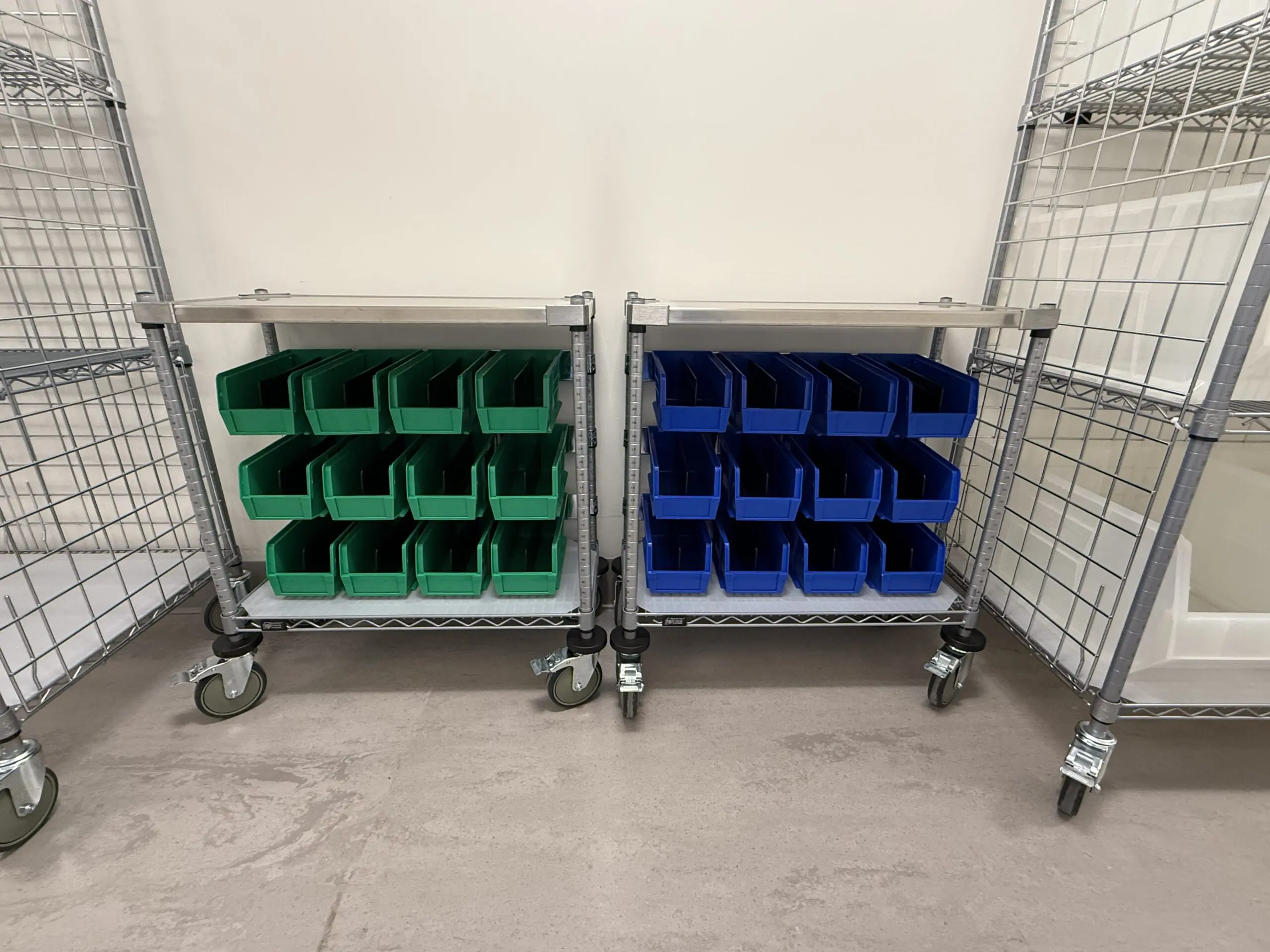 Mobile shelving with green storage bins
