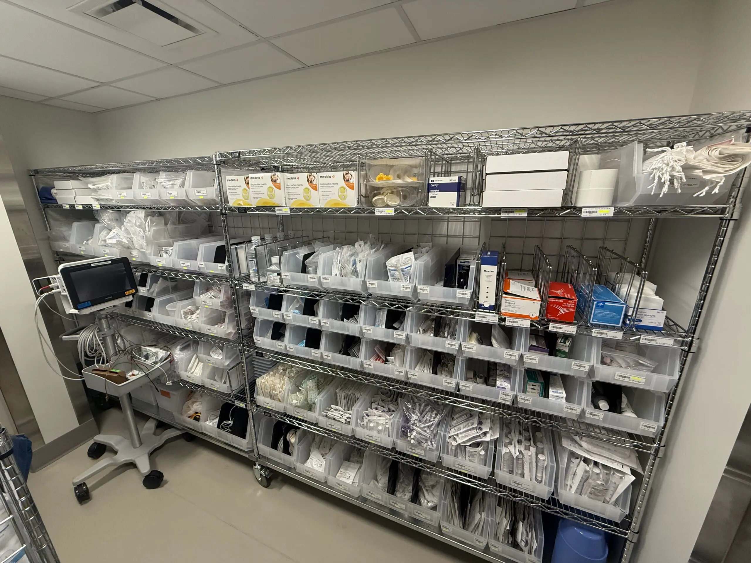 metal shelves stocked with medical supplies