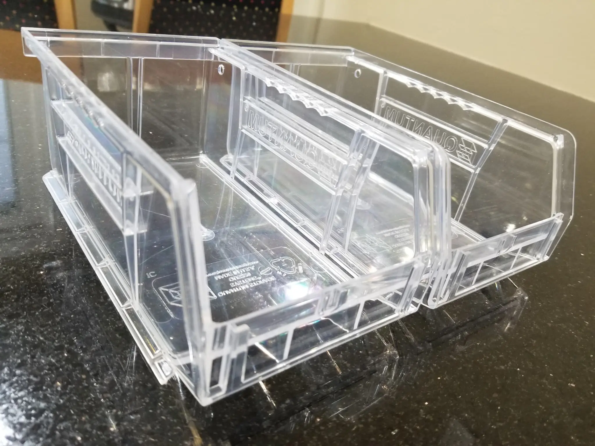 Clear plastic drawer organizer on black countertop