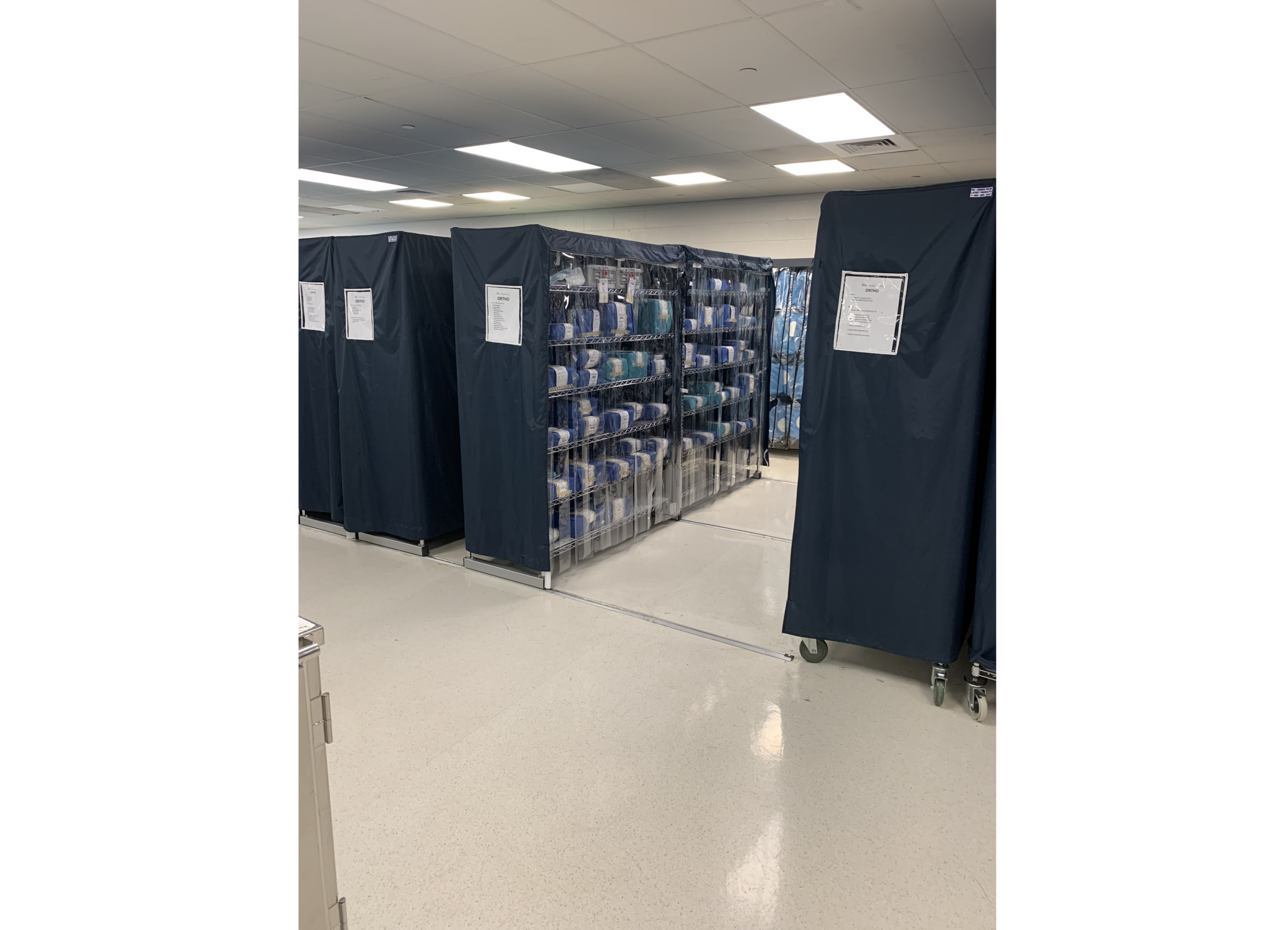 Covered medical linen carts in storage room